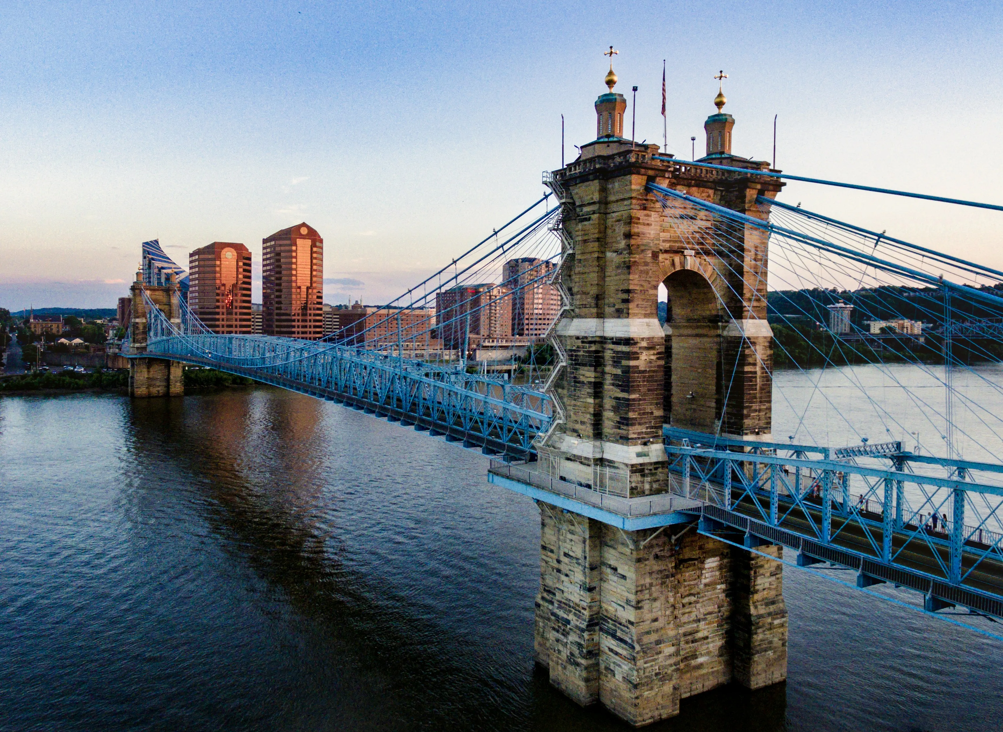 brown and blue concrete bridge by Robert Conklin courtesy of Unsplash.